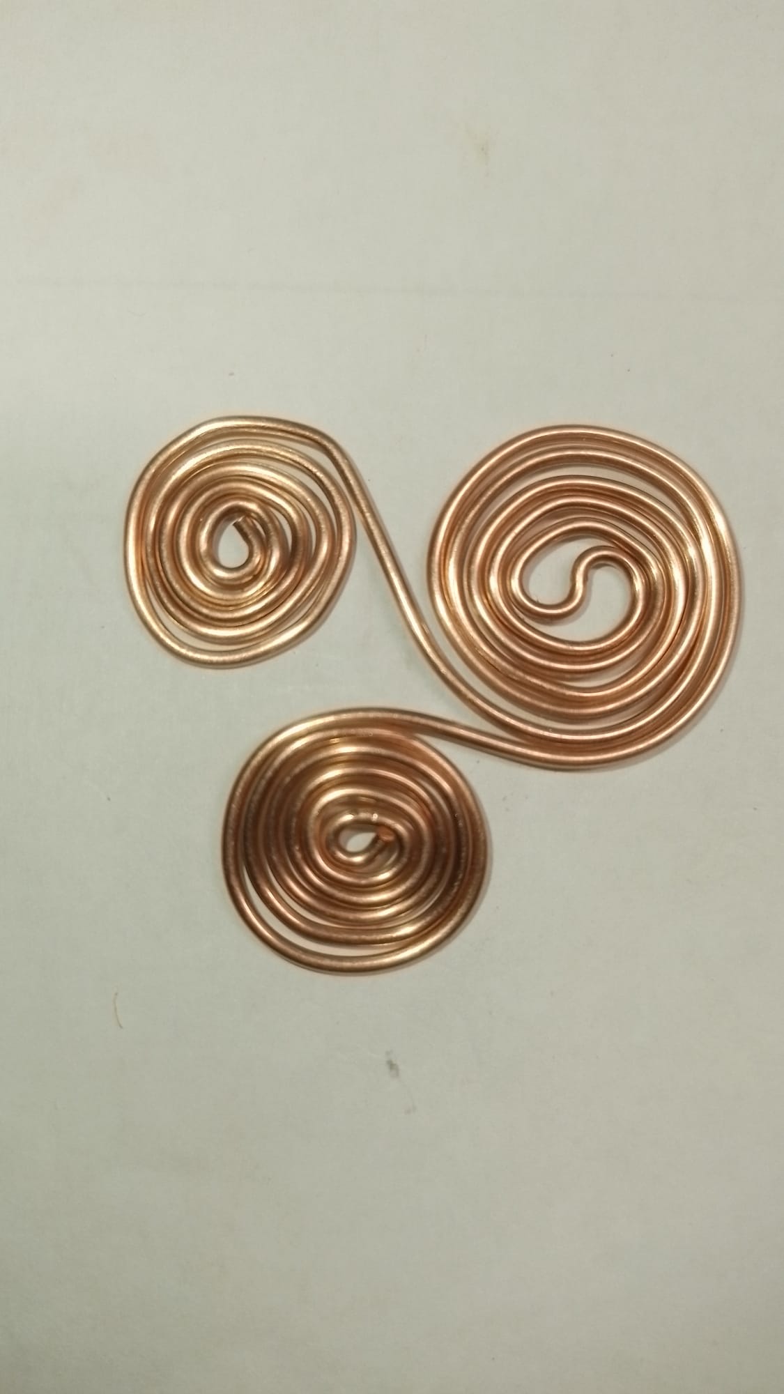 Now, look at the craftsmanship of this pure copper Triskelion spiral, a 144 MHz resonance tool measured to the Royal Cubit for EMF protection and water structuring. Hand-crafted in Ireland from Tuatha Dé Danann sacred copper, this authentic spiritual instrument brings ancient peace and physical harmony to the modern soul.